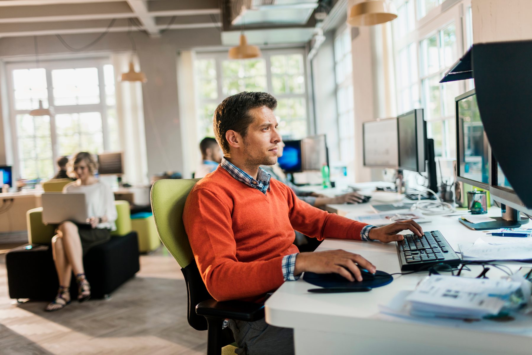 Focused software professional working at a computer