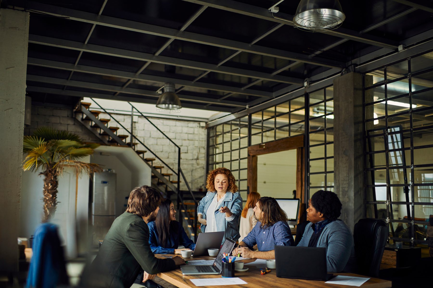 Business team meeting in a warm loft office